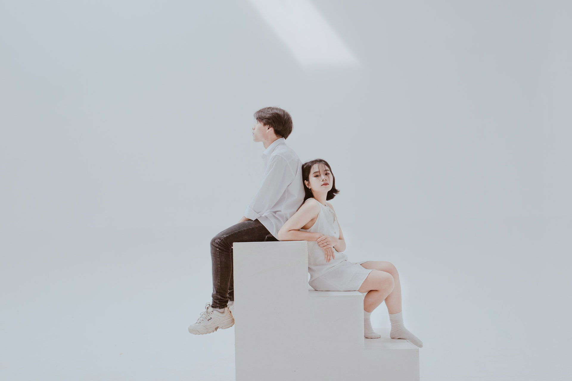 photo-of-woman-sitting-on-staircase-beside-man-1336409.jpg